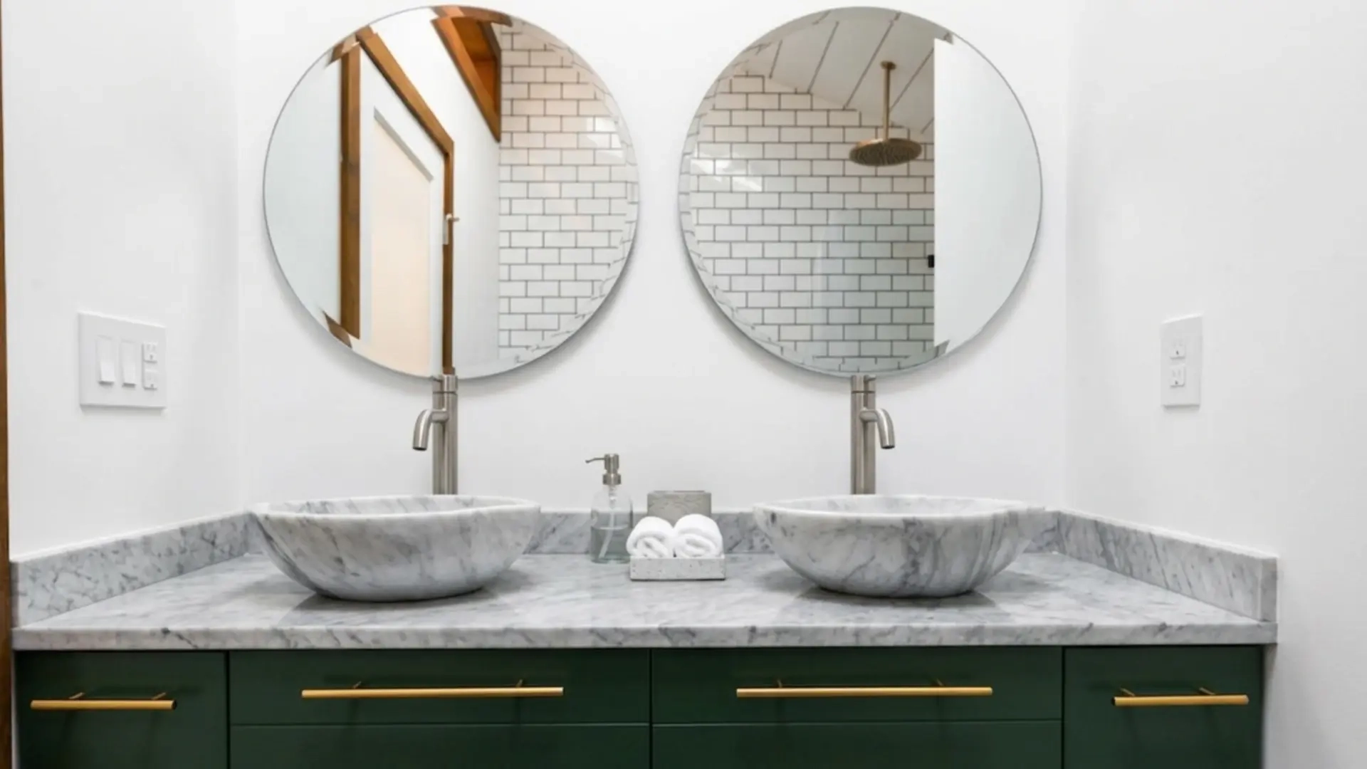 Modern bathroom double vanity with round mirrors and vessel sinks