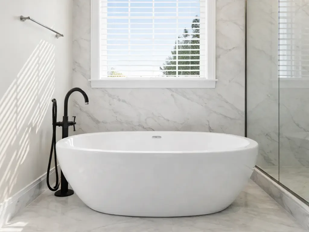 freestanding white bathtub in luxury bathroom